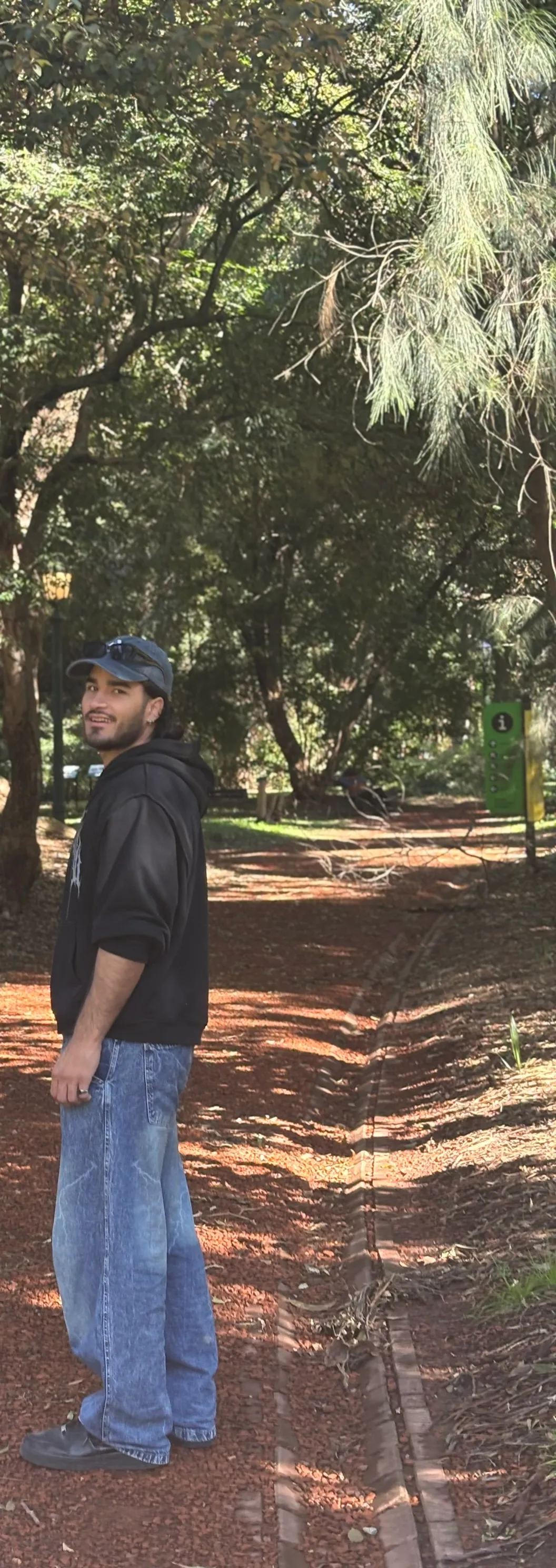 Bruno on a tree-lined path in a park